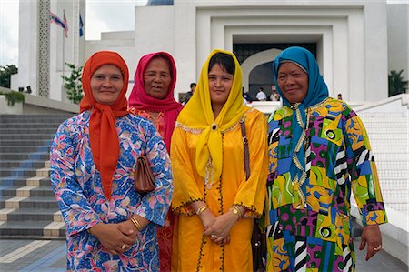 simsearch:841-02925433,k - Four women in traditional Muslim Malay dress, Kuala Lumpur, Malaysia, Southeast Asia, Asia Stock Photo - Rights-Managed, Code: 841-02831438