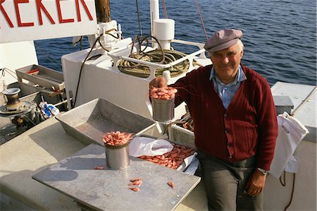 Shrimp seller on his boat in the harbour, Kristiansund, Norway, Scandinavia, Europe Stock Photo - Rights-Managed, Code: 841-02832120