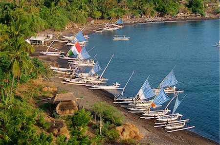 simsearch:841-02899056,k - Outrigger fishing boats line the beach at a hamlet on the east coast of Bali, on the Lombok Strait, Indonesia, Southeast Asia, Asia Stock Photo - Rights-Managed, Code: 841-02899056