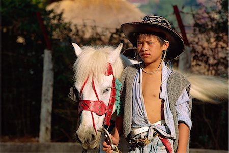 simsearch:841-02946644,k - Cowboy at Ho Than Tho Lake, Dalat City, Vietnam, Indochina, Southeast Asia, Asia Stock Photo - Rights-Managed, Code: 841-02899243
