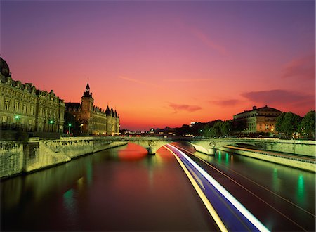 paris sunrise - Bateau mouche tourist boat blurred in passing under a bridge on the Seine at night, Paris, France, Europe Stock Photo - Rights-Managed, Code: 841-02899789