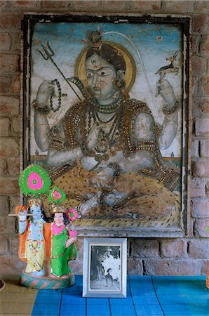 Painting of Krishna on glass, and photograph of Gandhi, in 1970s concrete structured home, Ahmedabad, Gujarat state, India, Asia Stock Photo - Rights-Managed, Code: 841-02900591