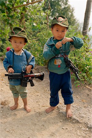Portrait of two boys with modern toy guns in Guizhou, China, Asia Stock Photo - Rights-Managed, Code: 841-02901246