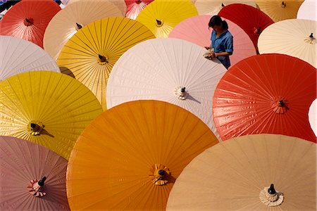 Woman finishing painted umbrellas in a village near Chiang Mai, Thailand, Southeast Asia, Asia Stock Photo - Rights-Managed, Code: 841-02902523