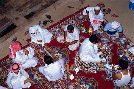 saudi arabia people - Overhead view of a group of men gathering for tea, cards and dominoes, Saudi Arabia, Middle East Stock Photo - Rights-Managed, Code: 841-02915433