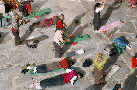 piety - Pilgrims prostrating in front square, Jokhang Buddhist temple, Lhasa, Tibet, China, Asia Stock Photo - Rights-Managed, Code: 841-02915765