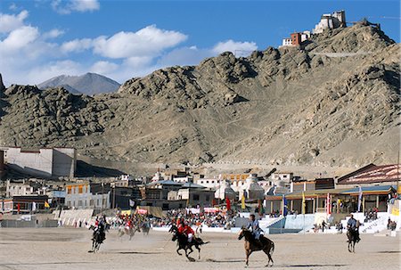 people ladakh - Game of polo on Leh polo field, Tsemo Gompa on ridge behind, Leh, Ladakh, India, Asia Stock Photo - Rights-Managed, Code: 841-02915832