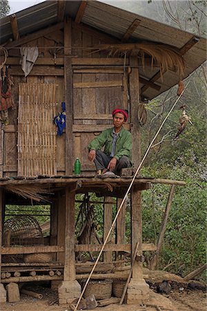 stilt house - Akha man sitting outside stilted house, Nun Lin Kong village (Akha Tribe), Kengtung (Kyaing Tong), Shan state, Myanmar (Burma), Asia Stock Photo - Rights-Managed, Code: 841-02916951