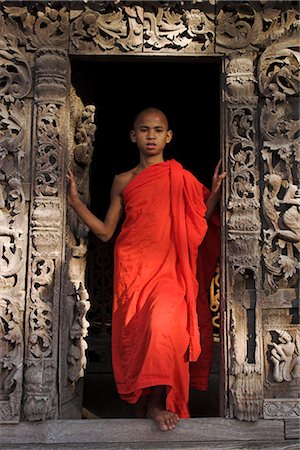 simsearch:841-02946644,k - Monk standing in doorway of traditional wooden monastery once part of the Royal Palace complex, Shwenandaw Kyaung (Golden Palace Monastery), Mandalay, Myanmar (Burma), Asia Stock Photo - Rights-Managed, Code: 841-02917139