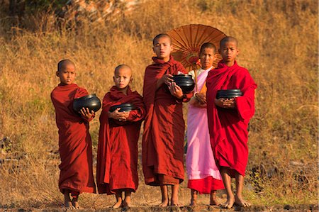 Nun with novice monks holding alms bowls at Mingun Paya, Mingun, Mandalay, Myanmar (Burma), Asia Stock Photo - Rights-Managed, Code: 841-02917320