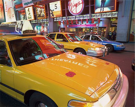 Yellow cabs on the street at night in Times Square, with Virgin Megastore in the background, in New York, United States of America, North America Stock Photo - Rights-Managed, Code: 841-02918475