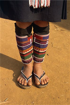 simsearch:841-02946091,k - Close-up of legs and feet of a person of the Akha hill tribe wearing colourful cloth leg coverings, at Doitung, Chiang Rai, Golden Triangle, Thailand, Southeast Asia, Asia Stock Photo - Rights-Managed, Code: 841-02918518