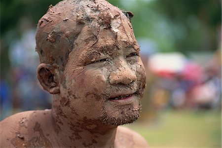 simsearch:841-02946648,k - Portrait of a Worship man with a muddy face during Loei Peetakhon festival in Thailand, Southeast Asia, Asia Stock Photo - Rights-Managed, Code: 841-02918525