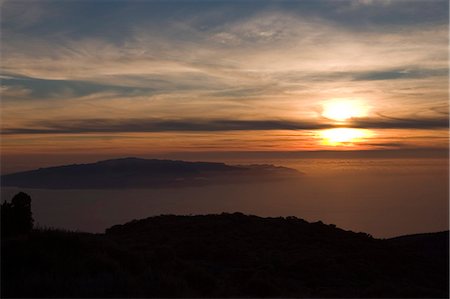 Sunset from Parque Nacional de Las Canadas del Teide (Teide National Park), looking south west to La Gomera, Tenerife, Canary Islands, Spain, Atlantic, Europe Stock Photo - Rights-Managed, Code: 841-02919807