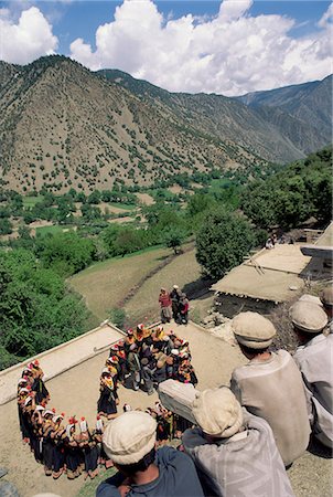 simsearch:841-02915818,k - Men watching Kalash women dancing, Spring Festival, Joshi, Bumburet Valley, Pakistan, Asia Stock Photo - Rights-Managed, Code: 841-02924485