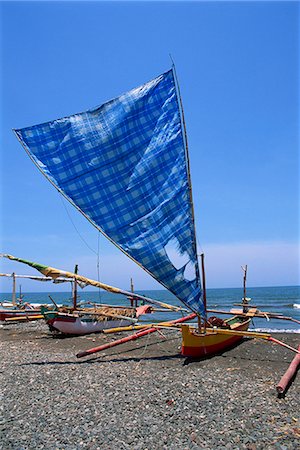 simsearch:841-02899056,k - Traditional outrigger boats which fish at night for squid, on the beach during the day, on the island of Bali, Indonesia, Southeast Asia, Asia Stock Photo - Rights-Managed, Code: 841-02925630