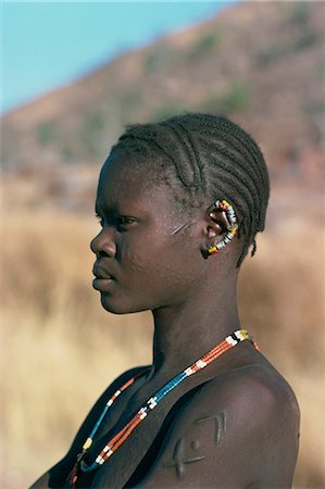 sudan - Portrait of Nuba woman with earrings and scars, Sudan, Africa Stock Photo - Rights-Managed, Code: 841-02920254