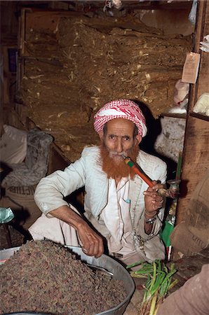 Portrait of an elderly shopkeeper with henna dyed beard, smoking a pipe, Djiblah, Yemen, Middle East Stock Photo - Rights-Managed, Code: 841-02920280