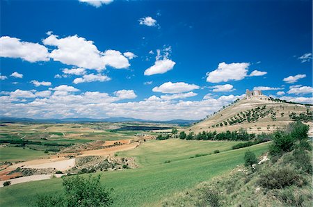 View to castle on hill above fields, Jadraque, Guadalajara, Castilla-La Mancha, Spain, Europe Stock Photo - Rights-Managed, Code: 841-02920438