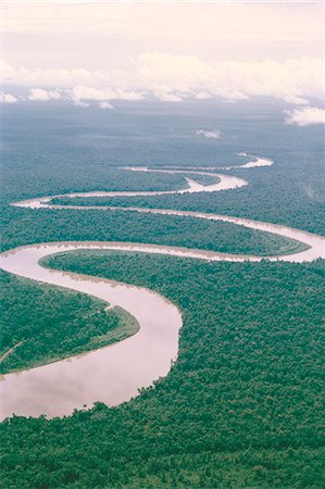 Aerial view of river and forest, West Irian (Irian Jaya). Indonesia, Southeast Asia, Asia Stock Photo - Rights-Managed, Code: 841-02945430