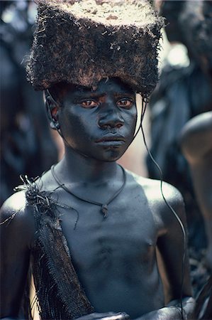simsearch:841-02946648,k - Portrait of a boy covered in pig-fat and charcoal in Papua New Guinea, Pacific Islands, Pacific Stock Photo - Rights-Managed, Code: 841-02946644