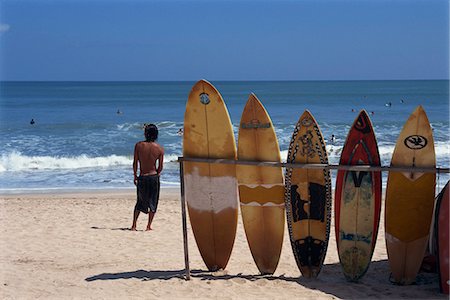 simsearch:841-02899056,k - A line of surfboards waiting for hire at Kuta beach on the island of Bali, Indonesia, Southeast Asia, Asia Stock Photo - Rights-Managed, Code: 841-02990598