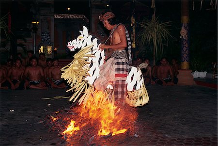 fire dance - Portrait of a man riding a straw horse, walking on coals during fire dancing at night, Bali, Indonesia, Southeast Asia, Asia Stock Photo - Rights-Managed, Code: 841-02991021