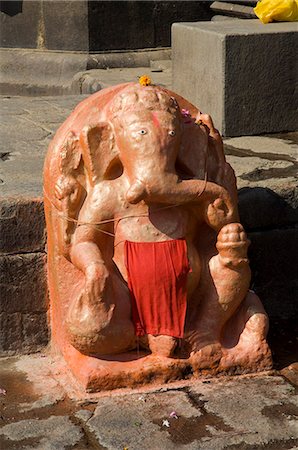 elephant god - Outdoor Hindu shrine to Ganesh, the elephant god, on the ghats below Ahilya Fort, Maheshwar, Madhya Pradesh state, India, Asia Stock Photo - Rights-Managed, Code: 841-02992272