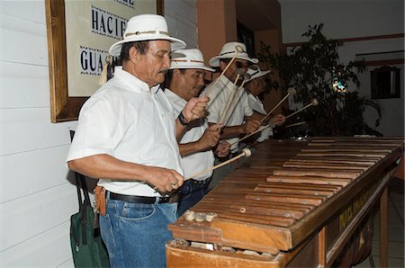 Musicians playing a type of xylophone, Hacienda Guachipelin, near Rincon de la Vieja National Park, Guanacaste, Costa Rica, Central America Stock Photo - Rights-Managed, Code: 841-02992557