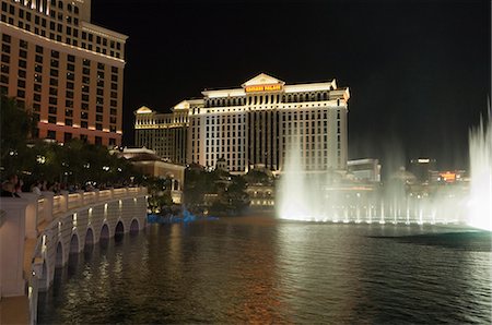 The Bellagio Hotel in forground with Caesar's Palace in background at night, Las Vegas, Nevada, United States of America, North America Stock Photo - Rights-Managed, Code: 841-03028023