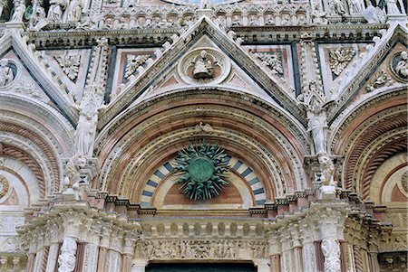 designs for decoration of pillars - Gothic detail on the facade of the Duomo (Cathedral), including the sun symbol, Siena, UNESCO World Heritage Site, Tuscany, Italy, Europe Stock Photo - Rights-Managed, Code: 841-03028735