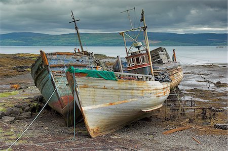 Wrecked fishing boats in gathering storm, Salen, Isle of Mull, Inner Hebrides, Scotland, United Kingdom, Europe Stock Photo - Rights-Managed, Code: 841-03032361