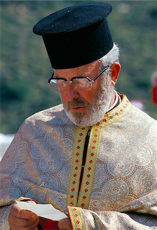 Portrait of a Greek Orthodox priest praying during Lambri Triti festival, Olymbos (Olimbos), Karpathos, Dodecanese islands, Greece, Mediterranean, Euope Stock Photo - Rights-Managed, Code: 841-03033534