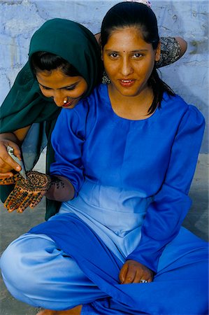 Portrait of two young women applying henna to hand, Jaisalmer, Rajasthan state, India, Asia Stock Photo - Rights-Managed, Code: 841-03033687