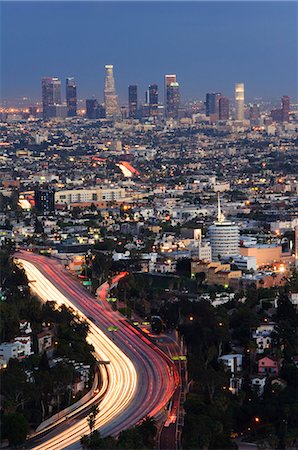 Downtown district skyscrapers and car lights on a city highway, Los Angeles, California, United States of America, North America Stock Photo - Rights-Managed, Code: 841-03055281