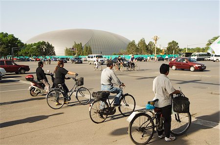 scooter rear view - The National Theatre designed by the French architect Paul Andreu, and cyclists commuting in central Beijing, Beijing, China, Asia Stock Photo - Rights-Managed, Code: 841-03055410