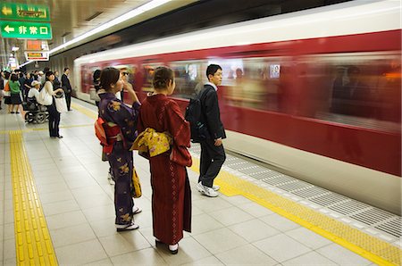 Young women wearing kimono waiting for train to arrive at Kyoto Station, Kyoto, Honshu Island, Japan, Asia Stock Photo - Rights-Managed, Code: 841-03055624