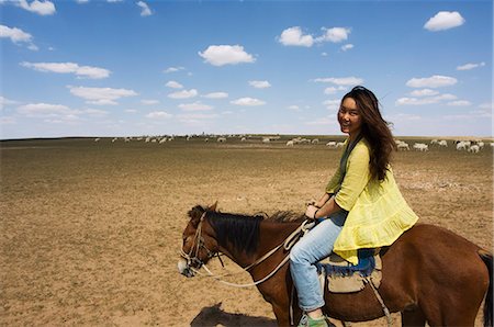 Chinese girl horseriding, Xilamuren grasslands, Inner Mongolia province, China, Asia Stock Photo - Rights-Managed, Code: 841-03055653