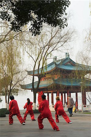 Women practising tai chi in front of a pavilion on West Lake, Hangzhou, Zhejiang Province, China, Asia Stock Photo - Rights-Managed, Code: 841-03055898