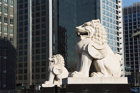 A stone lion statue in the CBD business district, Beijing, China, Asia Stock Photo - Rights-Managed, Code: 841-03055974