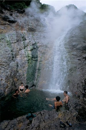 Relaxing in volcanic hot water waterfall, Kamuiwakka-no-taki falls, Shiretoko National Park, Hokkaido, Japan, Asia Stock Photo - Rights-Managed, Code: 841-03056261