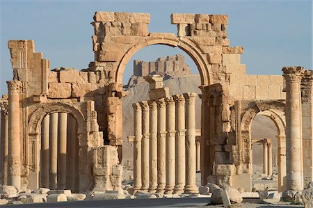 simsearch:841-02831081,k - Qala'at ibn Maan castle seen through monumental arch, archaelogical ruins, Palmyra, UNESCO World Heritage Site, Syria, Middle East Stock Photo - Rights-Managed, Code: 841-03056631