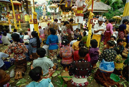 Hindu worshippers receiving holy water in Pura Taman Pule temple on Kuningan Day, Mas, Gianyar District, Bali, Indonesia, Southeast Asia, Asia Stock Photo - Rights-Managed, Code: 841-03067400