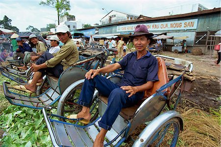 simsearch:841-02925433,k - Cyclo drivers at a market in central Ho Chi Minh City (formerly Saigon), waiting for business, Vietnam, Indochina, Southeast Asia, Asia Stock Photo - Rights-Managed, Code: 841-03067509