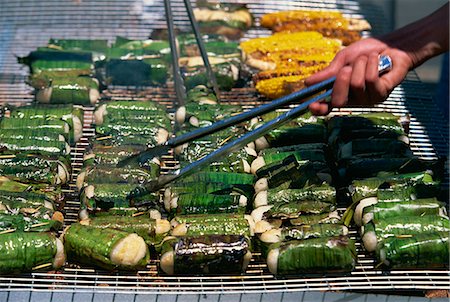 Sticky rice wrapped in banana leaves on barbecue at Vietnamese Lunar New Year Festival in Footscray, a suburb of Melbourne, Victoria, Australia, Pacific Stock Photo - Rights-Managed, Code: 841-03067716