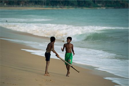 Boys playing cricket, Hikkaduwa beach, Sri Lanka, Asia Stock Photo - Rights-Managed, Code: 841-03061779