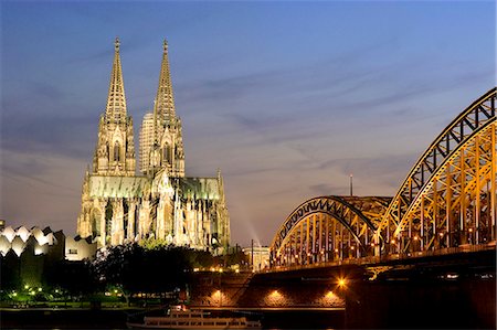 Cologne cathedral, UNESCO World Heritage Site, and Hohenzollern bridge at night, Cologne, North Rhine Westphalia, Germany, Europe Stock Photo - Rights-Managed, Code: 841-03061938