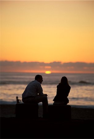 simsearch:841-03061953,k - Silhouette of a couple watching the sunset, Camps Bay beach, Cape Town, South Africa, Africa Stock Photo - Rights-Managed, Code: 841-03062050