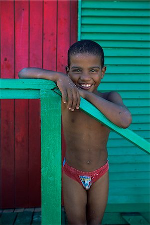 simsearch:841-03061953,k - Young boy stands by colourfully painted Victorian bathing hut in False Bay, Cape Town, South Africa, Africa Stock Photo - Rights-Managed, Code: 841-03062136