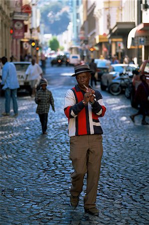 simsearch:841-03061953,k - Man playing a flute while walking in the street in the city centre, Cape Town, South Africa, Africa Stock Photo - Rights-Managed, Code: 841-03062260